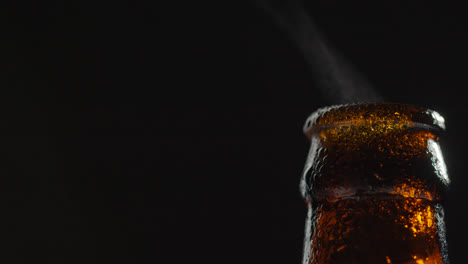 Close-Up-Of-Condensation-Droplets-On-Neck-Of-Bottle-Of-Cold-Beer-Or-Soft-Drink-With-Water-Vapour-After-Opening-2